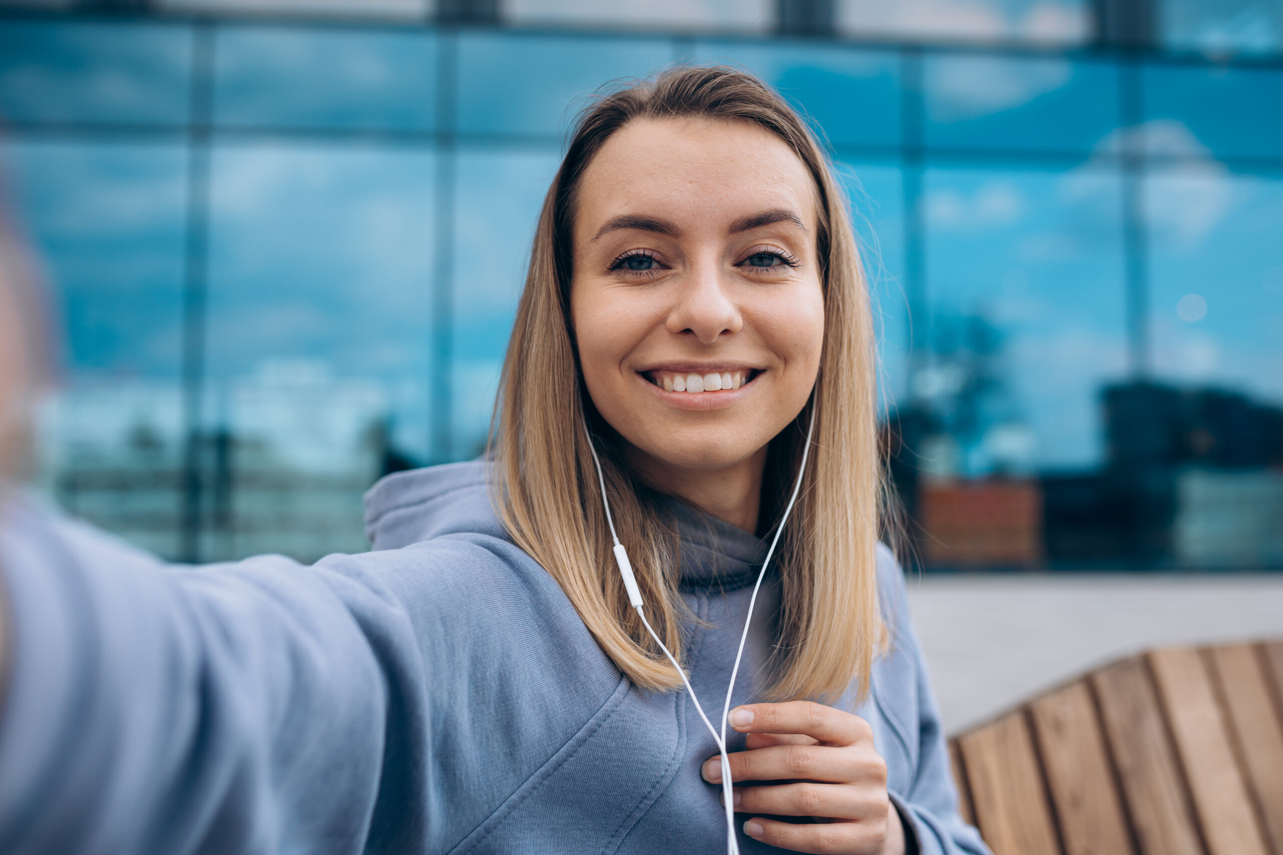 girl in earphones taking selfie outdoors 2025 01 09 03 10 09 utc scaled
